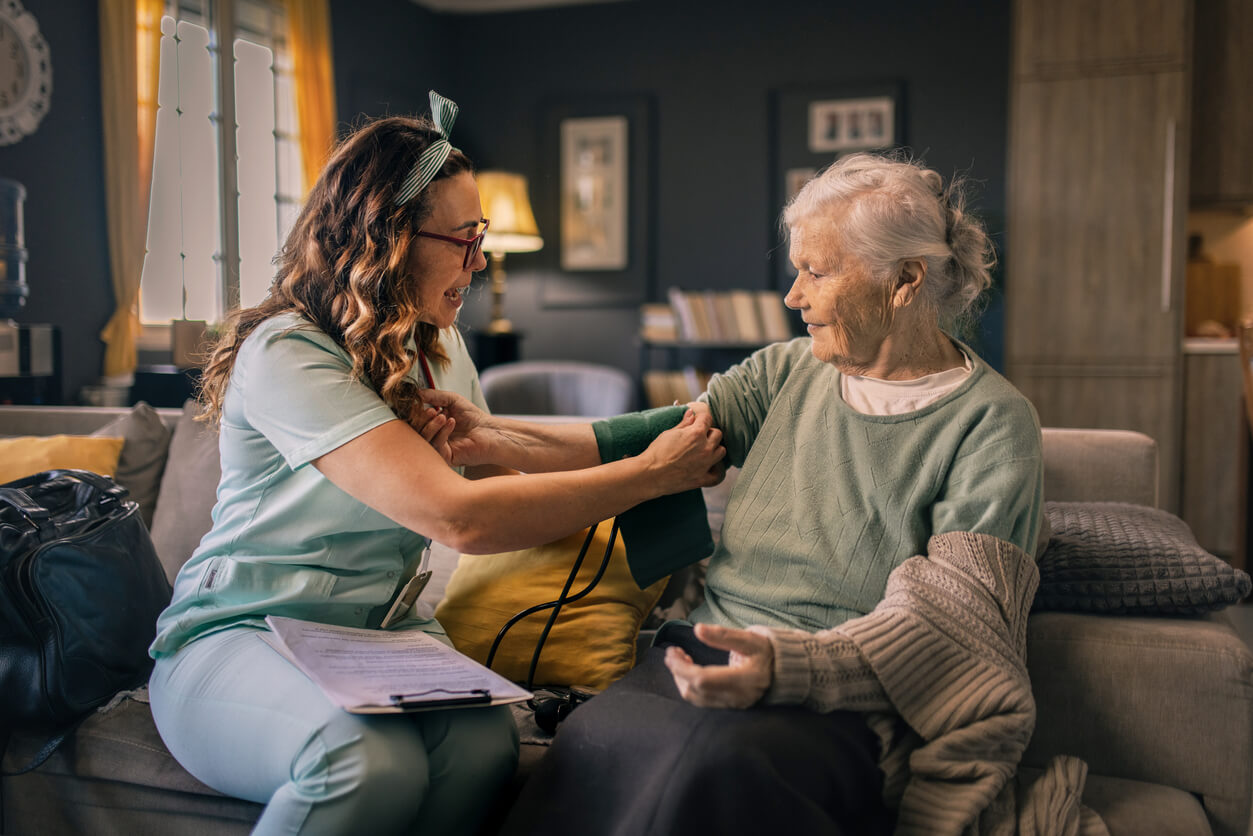 Inhome Nurse Taking Blood Pressure