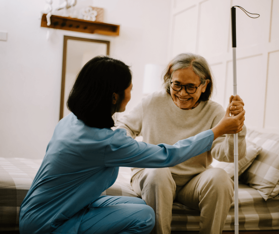 A nurse helping a patient at home who is recovering from a surgery